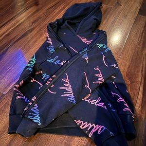 Black Adidas hoodies with rainbow colored writing. Size 10/12.